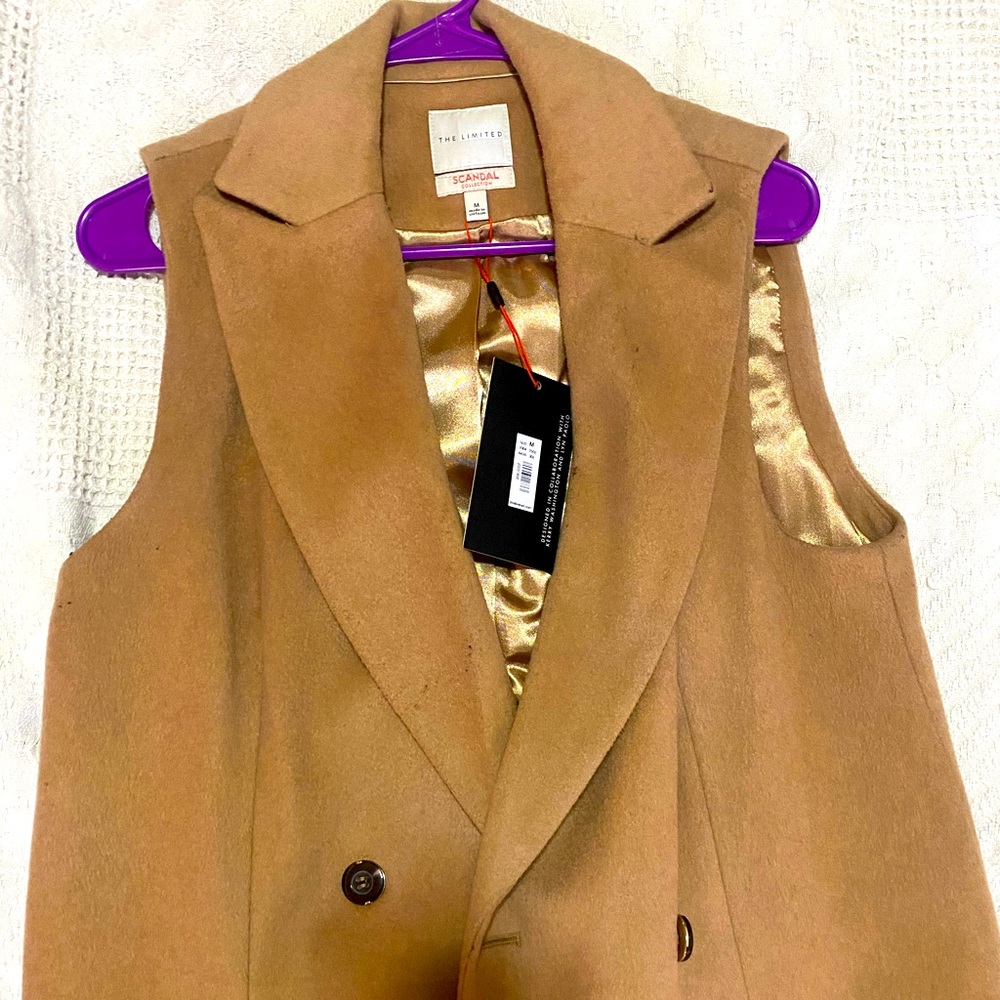 Never worn … new with tags. Long vest coat.